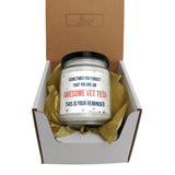 an open box with a candle inside of it