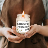 a person holding a candle with a message on it