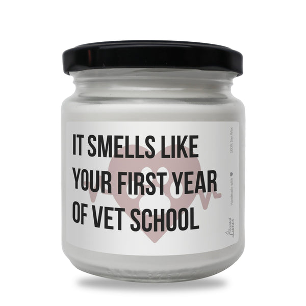 a white jar with a black lid that says it smells like your first year of