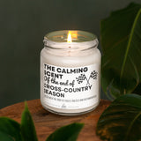 a white candle sitting on top of a wooden table