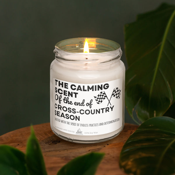 a white candle sitting on top of a wooden table