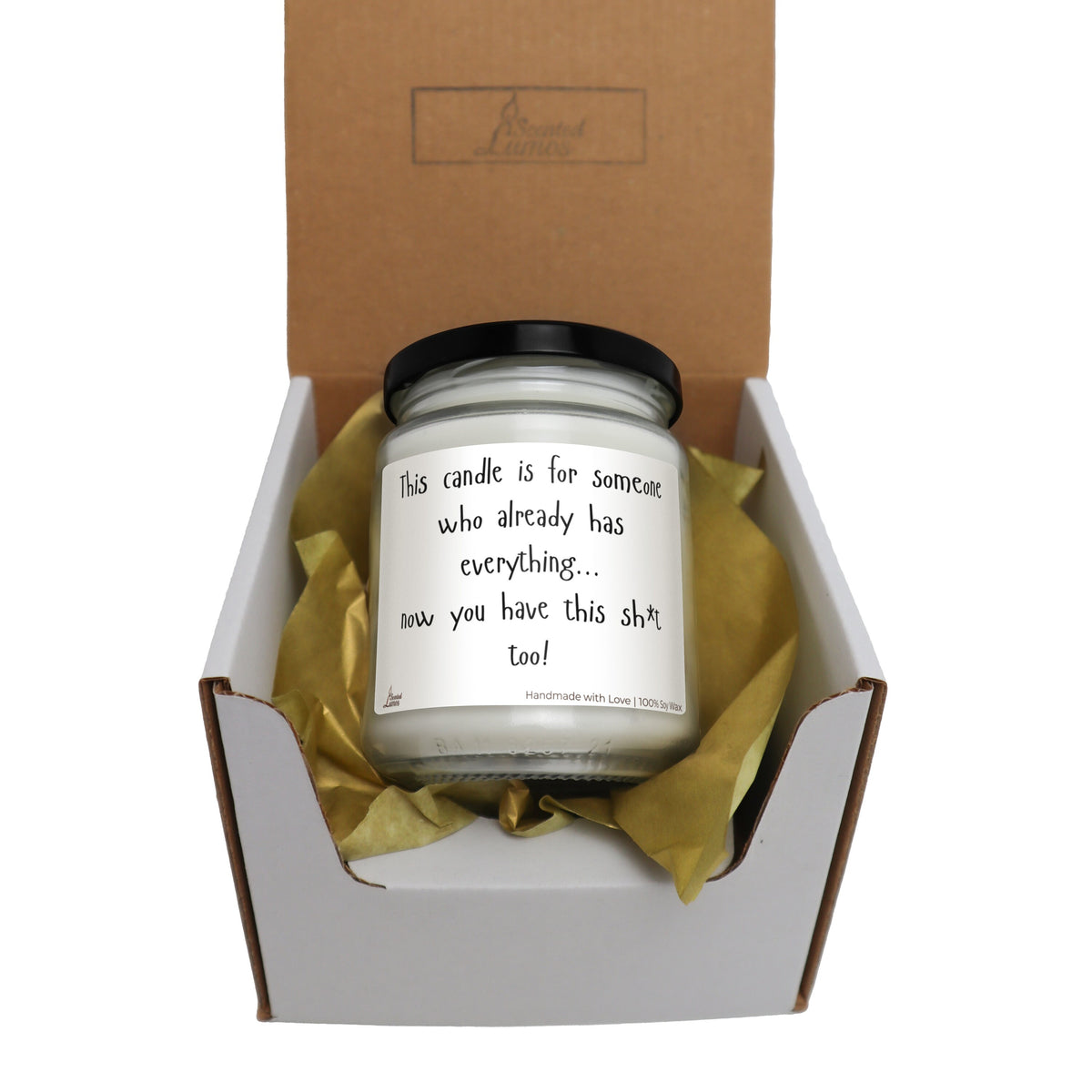 a candle in a box with a note on it